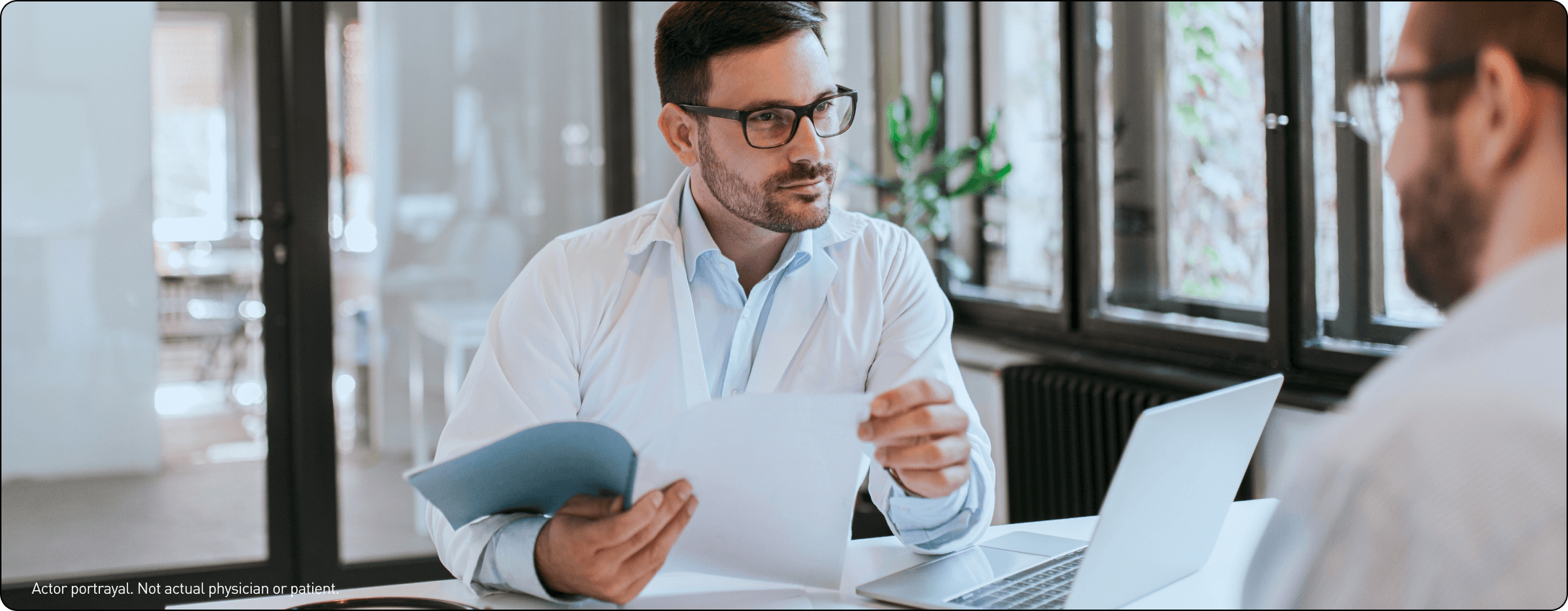 Doctor going through paperwork with an FCS patient